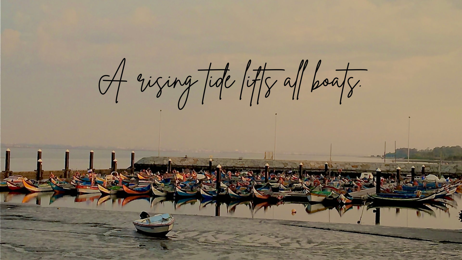 Portuguese fishing boats docked during low tide in Torreira, Portugal.